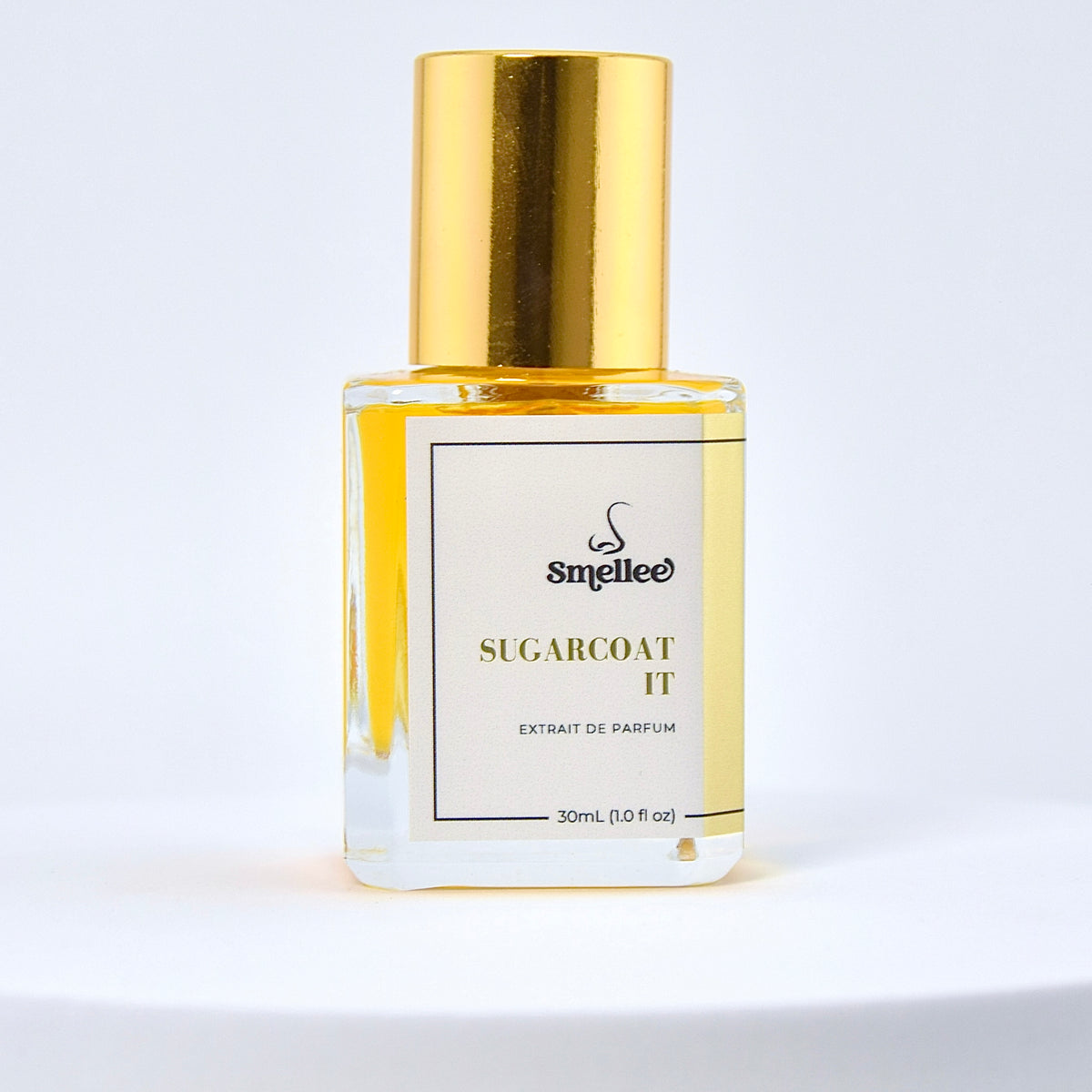 Perfume bottle labeled 'Sugarcoat It' by Smelliee on a white background