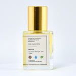 Clear bottle with gold cap on a white background