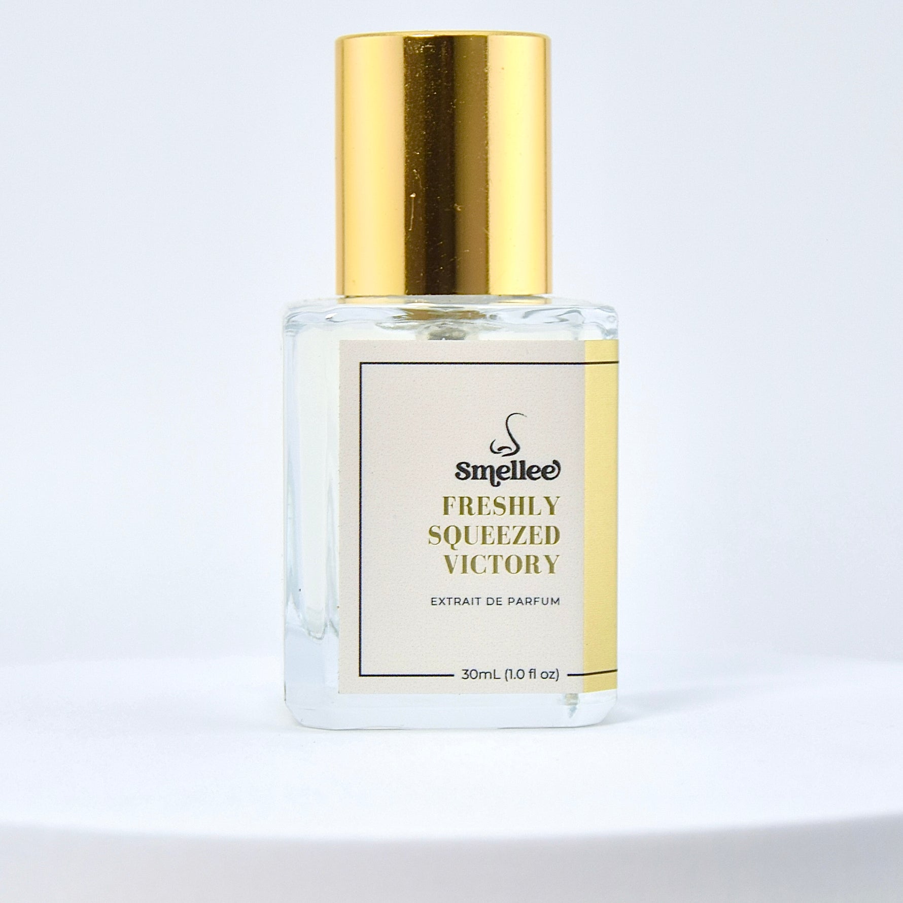 Perfume bottle labeled 'Freshly Squeezed Victory' by Smelliee on a light gray background