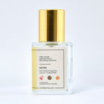 Perfume bottle with gold cap on a white background