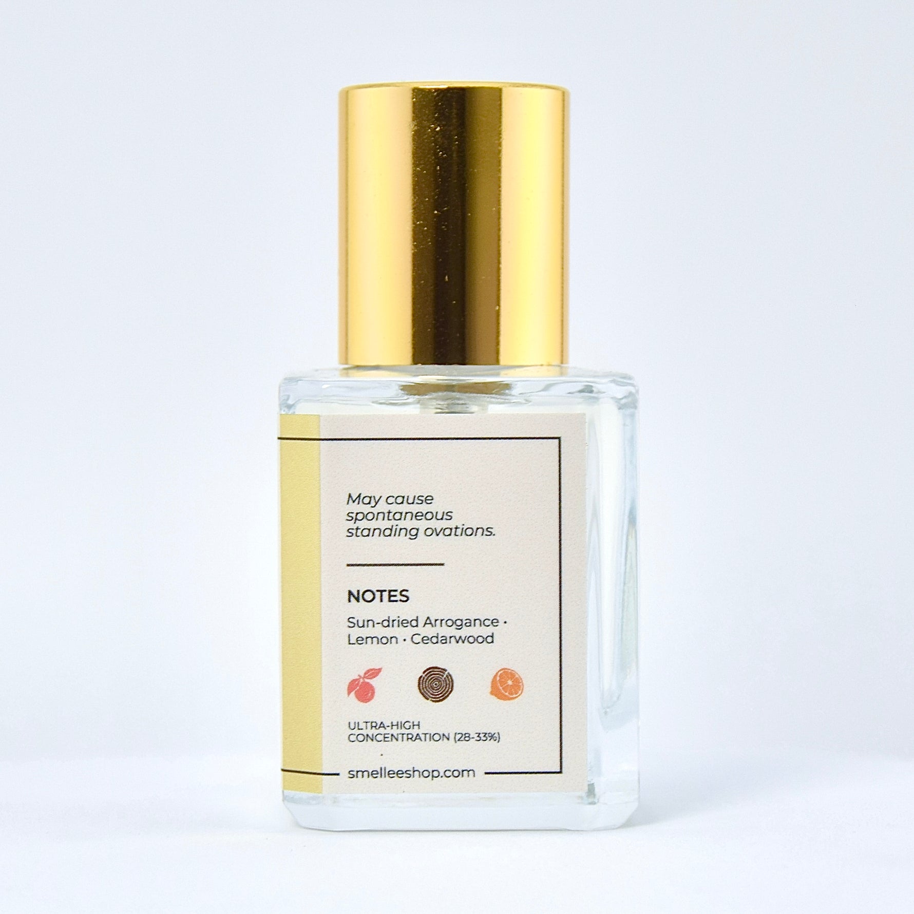 Perfume bottle with gold cap on a white background