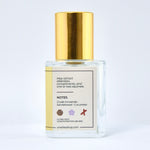 Clear bottle with gold cap on a white background